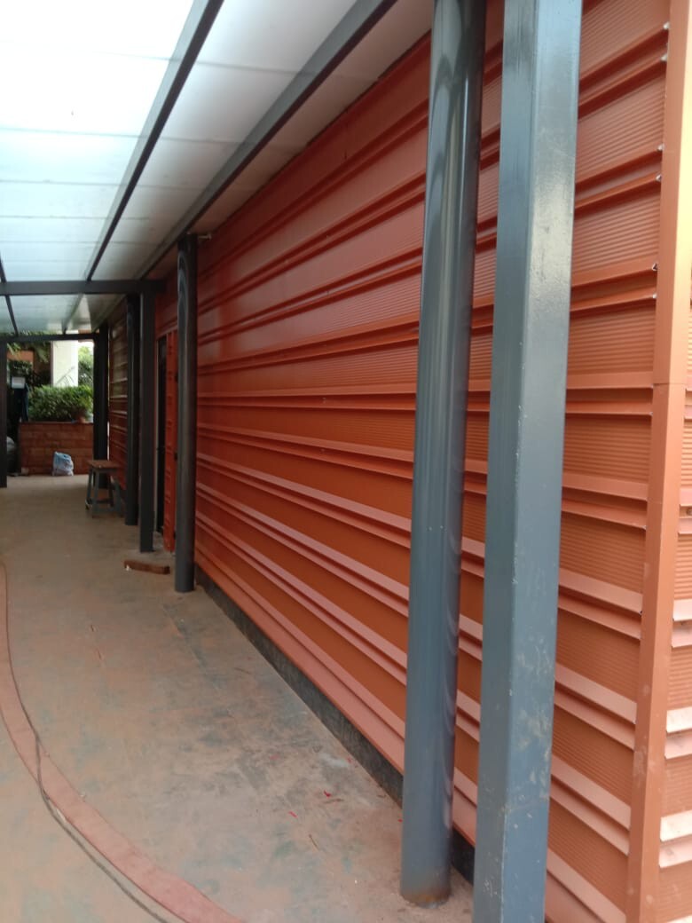 Architectural standing seam roofing for Lodha Mumbai: Premium metal building envelope featuring a minimalist aesthetic and hidden fastener technology by Rishonn & Reyansh.